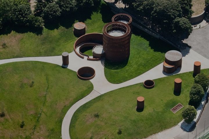 Contemporary silos in perforated corten steel and its negative inside.