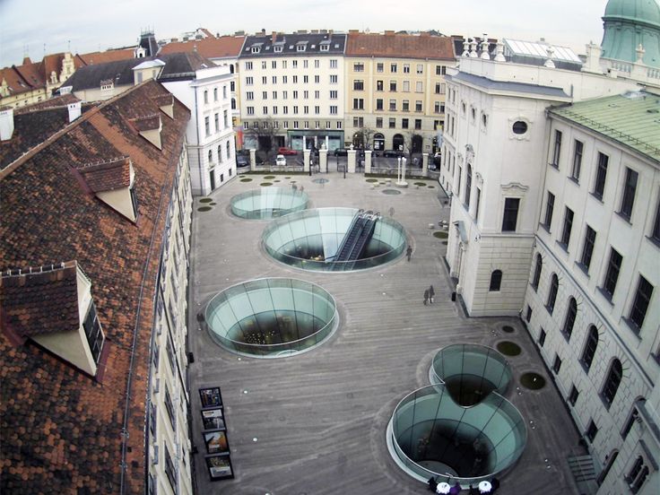 A public plaza is proposed to connect the two existing buildings and house the different required spaces underneath.