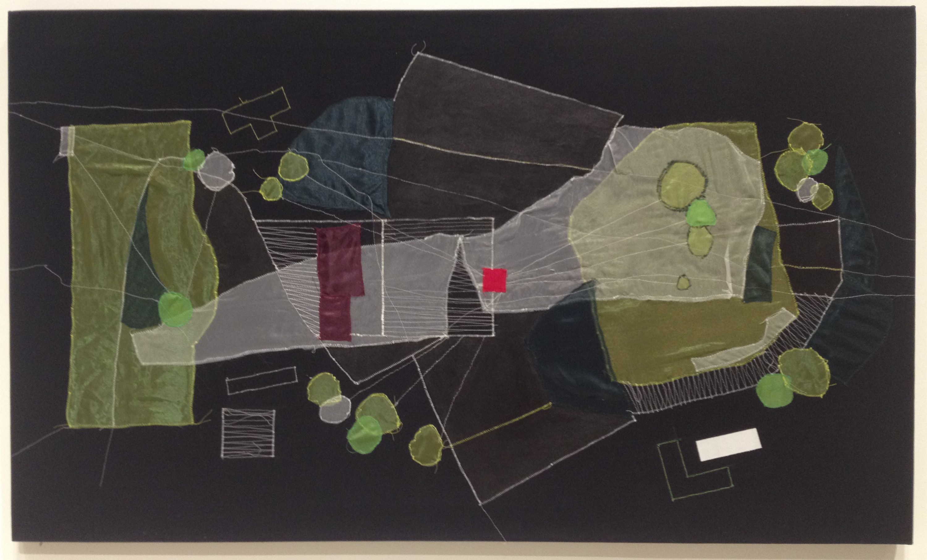 Christine Gedeon, OSH, Brooklyn (Plot re-visualized), Fabric, thread and paint on raw black canvas, 2012. The artist investigates built environment as it relates to collective memory, suggests an organically morphing city plan.